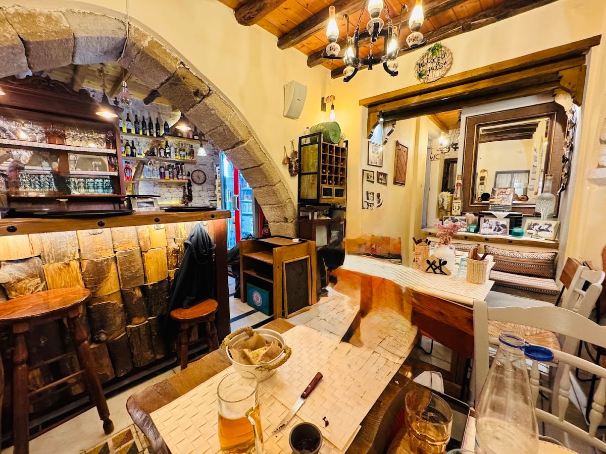 Metaxi mas - Mezedopoleio - We passed by while walking the old streets in the old town and it was buzzing but there was a table inside and we took it! It was great food. Sardines, zucchini fritters and the chips with Naxos cheese were sooo good.
