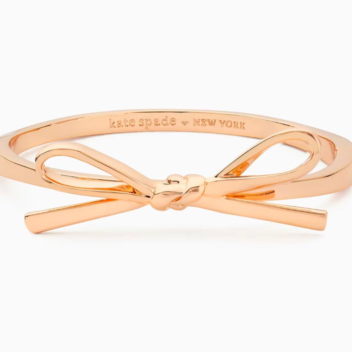 https://www.katespadeoutlet.com/products/skinny-mini-bow-bangle/K9250-650.html?utm_source=facebook.com-instagram.com&utm_medium=paid_soc&utm_campaign=HS_PERF_OO_US_PDSOC_FB_CTGS_Purchase_NoTt_MarpipeStrikethrough_NoC_CON_DYN%7CACQ_DEMO_NoST_AllProductsF_DABA_MulPla_MulDev_F_18plus_NoC%7CMarpipePERSNovDecGifting_NovDecGiftingStrikethrough4_NoAm_DYN_OtCa_NP_110124%7C120210086928220366%7C120212612360150366&utm_content=MCNVACQ
