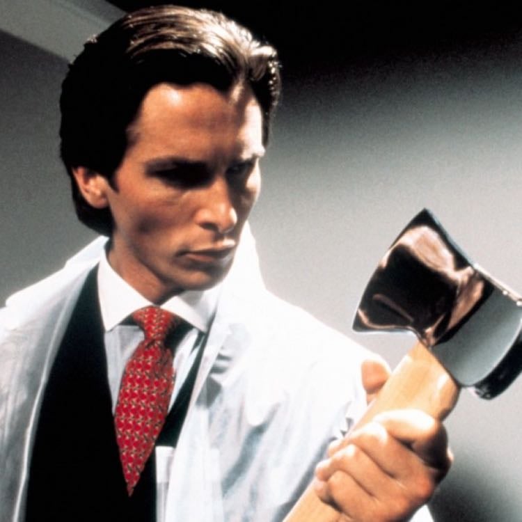 Patrick Bateman in American Psycho - A raincoat and tie