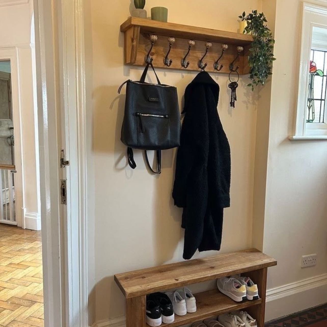 π‘ - place to hang jackets and put away shoes by the door