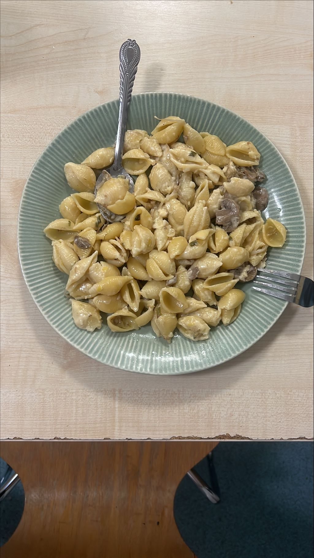 Pasta sauced with creamy mushrooms and beansprouts