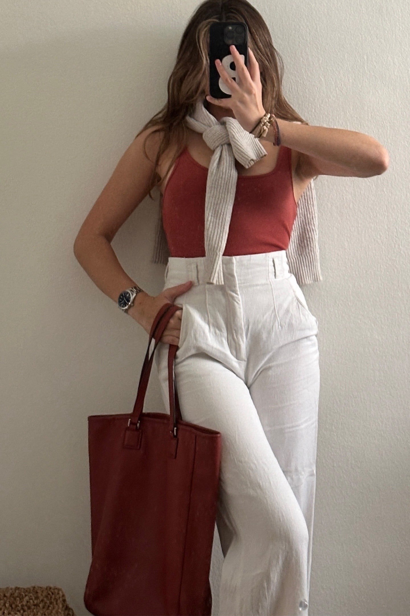 terracotta tank, white linen trousers, cognac tote