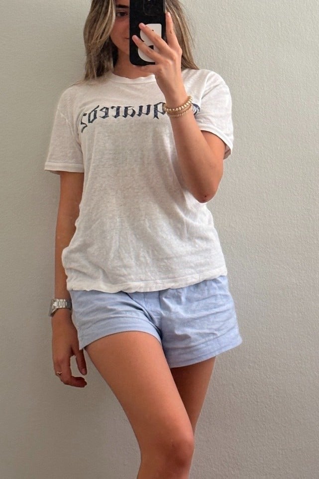 graphic tee, striped shorts, soft blue palette