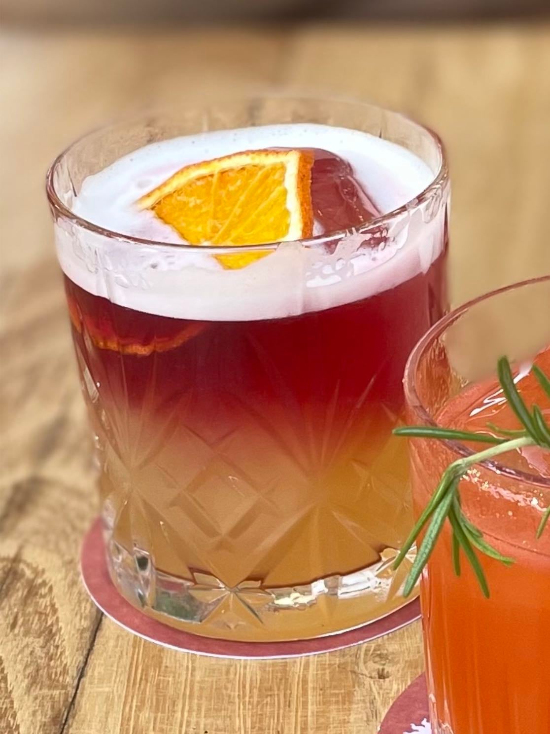 málaga sour - bourbon jim beam, mango, lemon and red wine