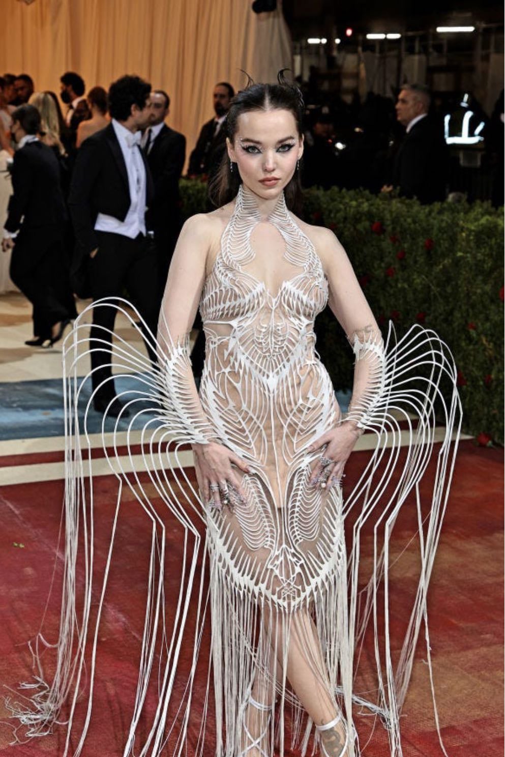 dove cameron - custom iris van herpen
a deconstructed design of a sheer, skin-like fabric with metal structures sprouting from the bodice. a futuristic interpretation of the theme titled ‘spiral nebula’