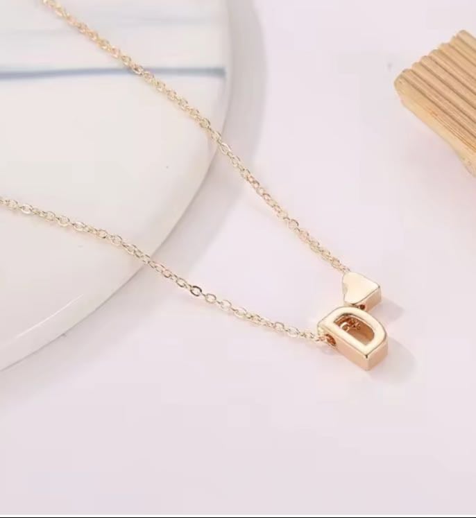 Gold R necklace