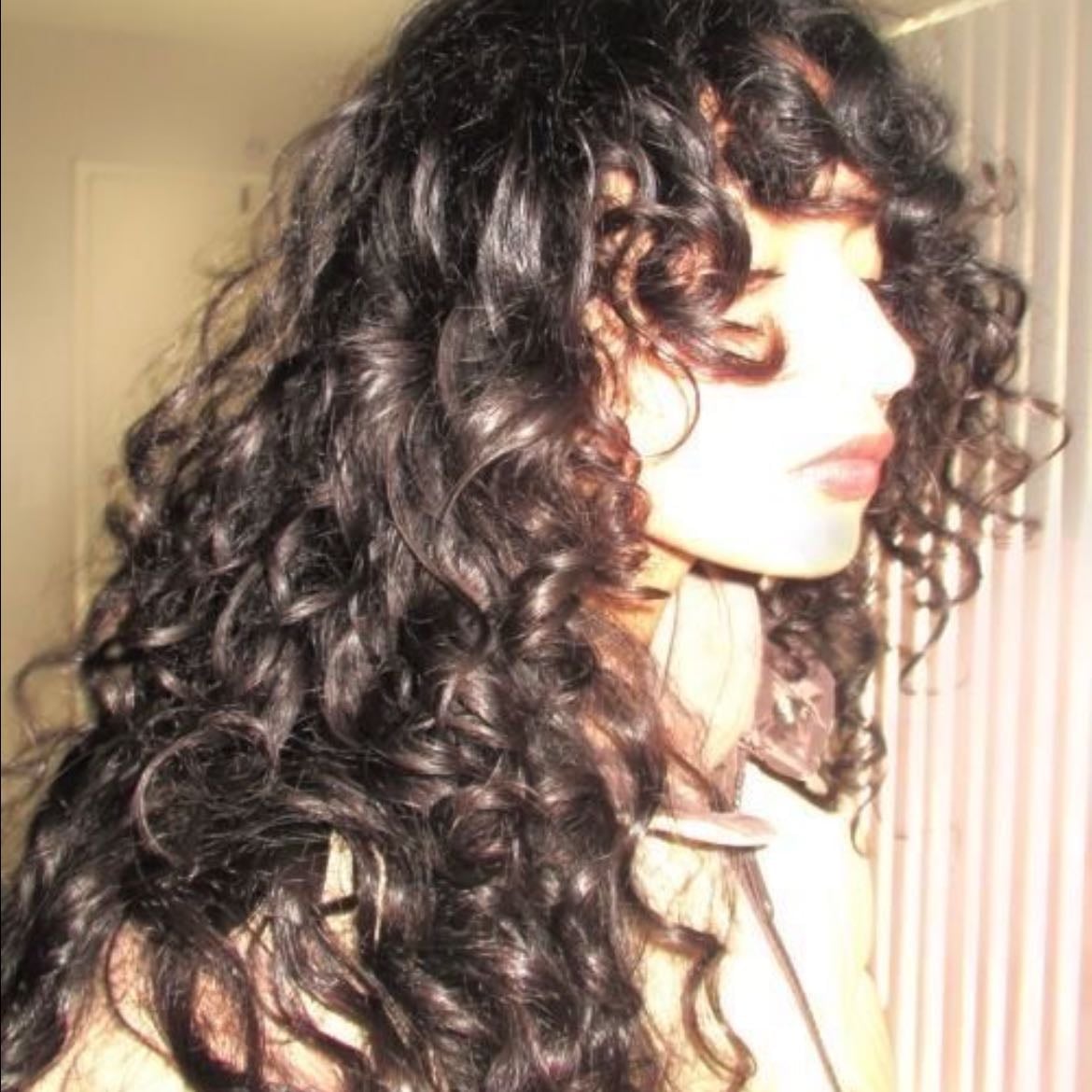 curly hair - it took her a long time to perfect her curl routine but she swears by it and never skips it