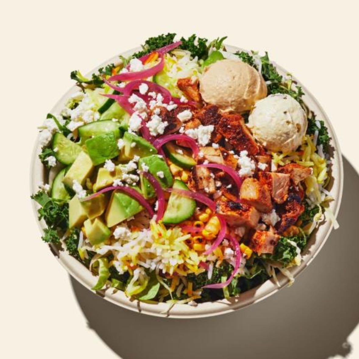 CAVA - greens & grains bowl, arugula, brown rice, crazy feta, 2x shredded romaine, 2x crumbled feta, 2x pita crisps, lemon herb tahini, tahini caesar, strawberry citrus or blueberry lemonade