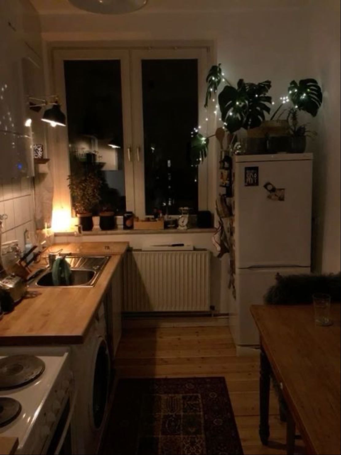 kitchen - unique cups, fridge filled with magnets, soft music, and a fire-hazard of books