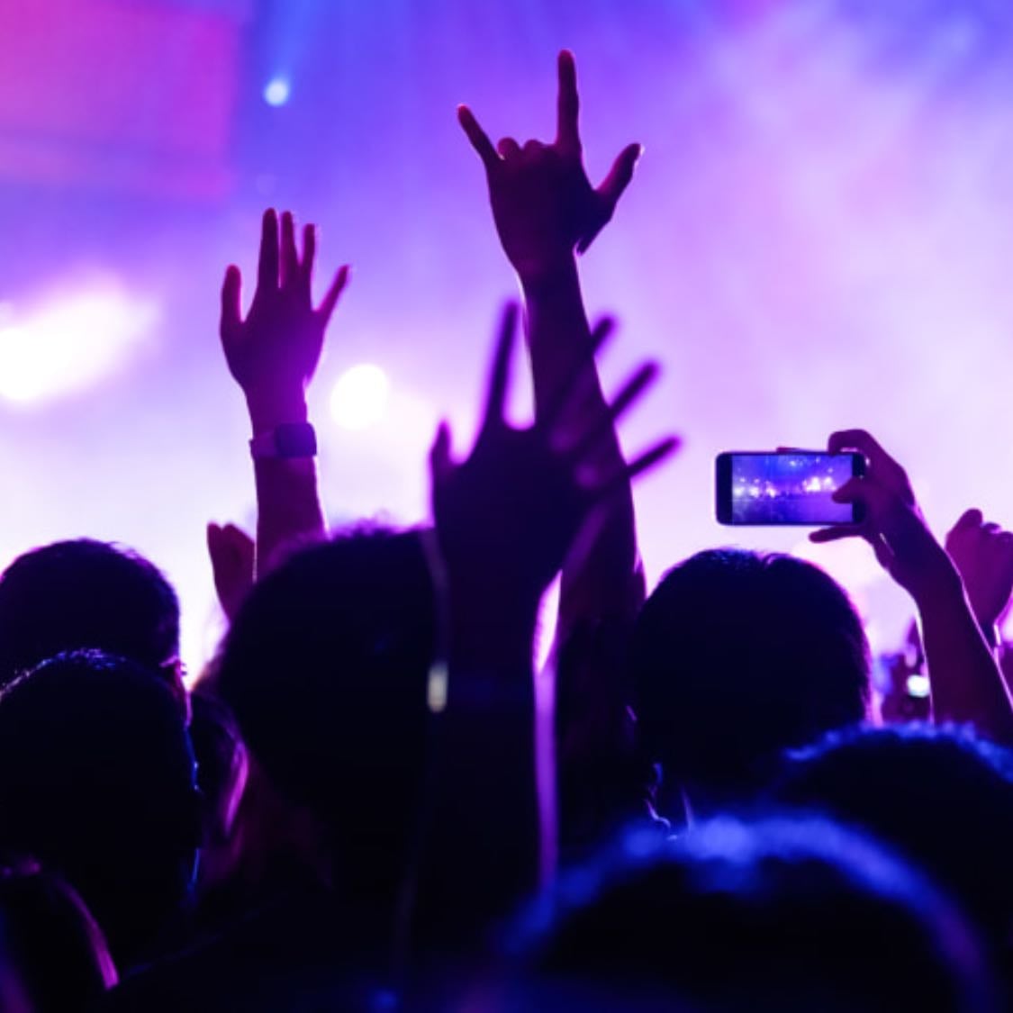The crowd singing in unison in concerts