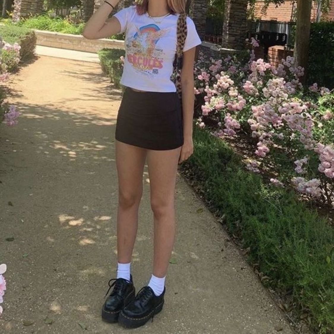#8 - -graphic tee, black skirt, loafers