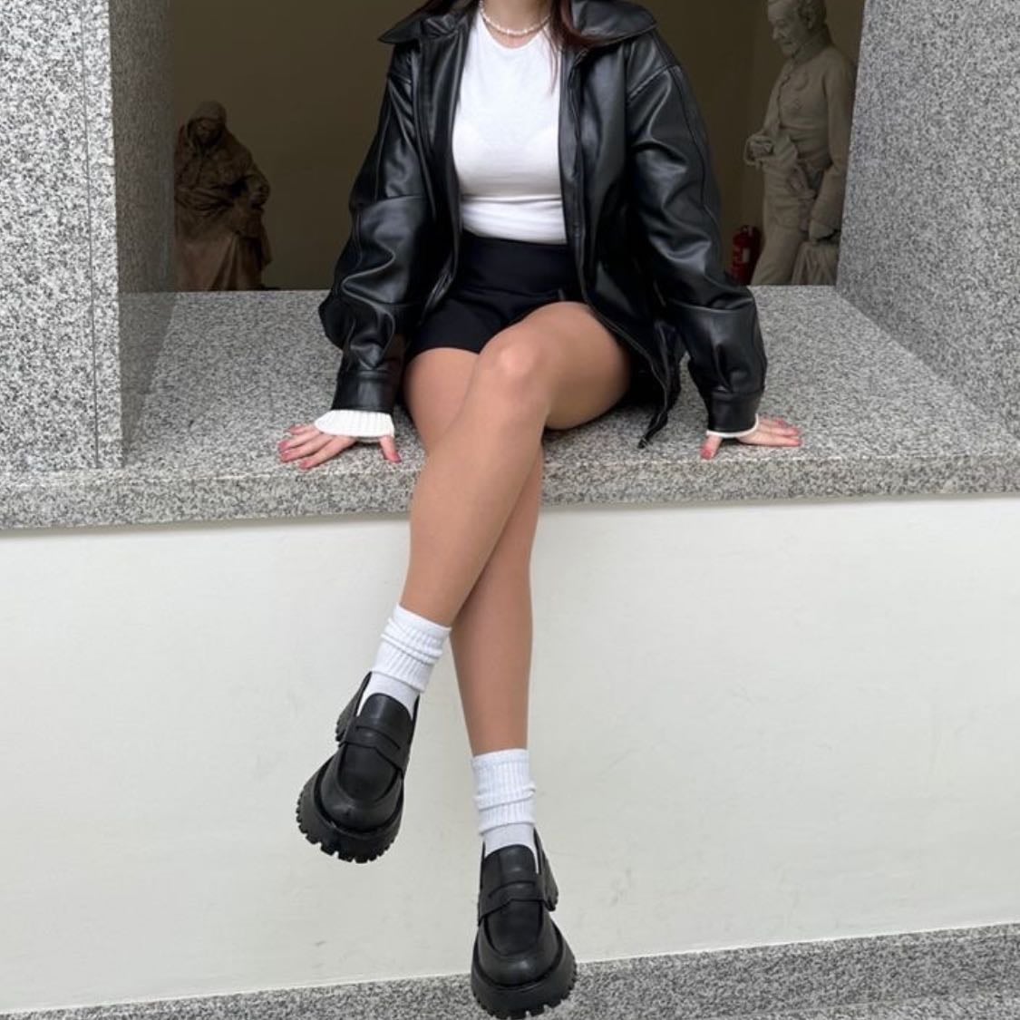 #5 - -white top, leather jacket, black skirt, loafers