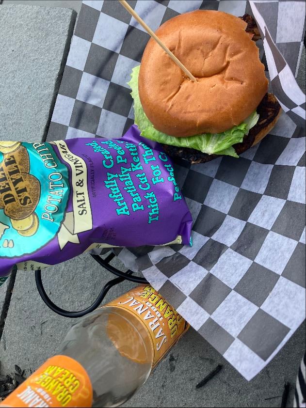 black bean burger & potato chips - w tomato, cheese, and lettuce. orange soda OS