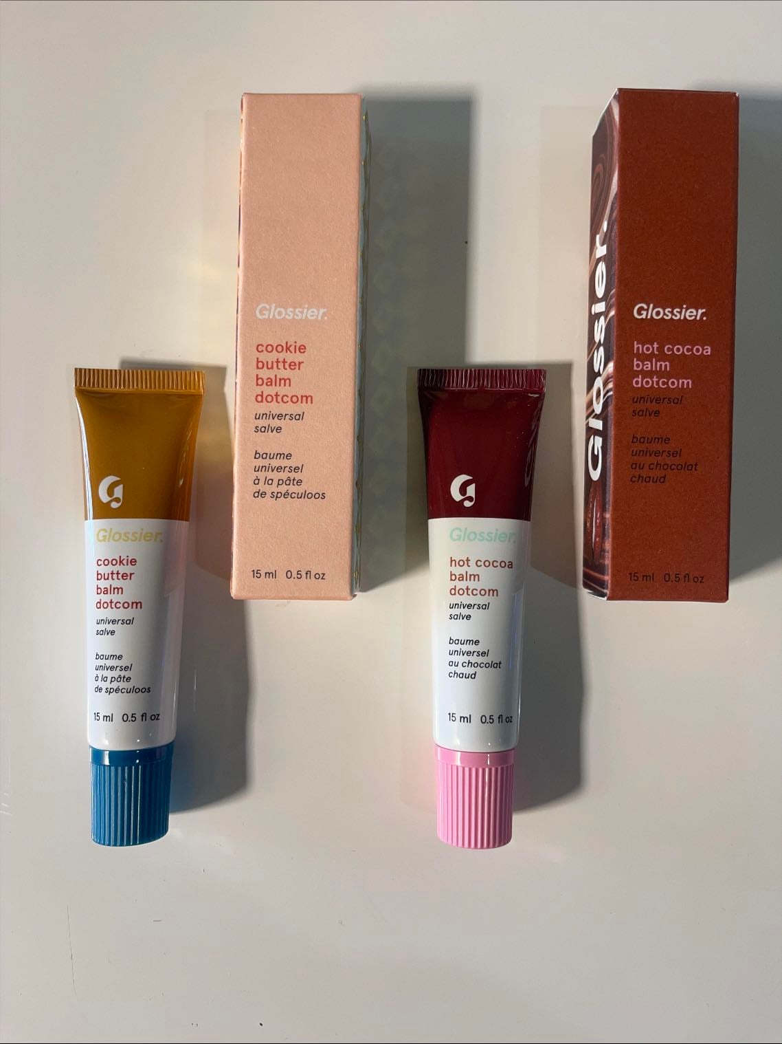 Glossier - Balm Dotcom · Limited Edition Cookie Butter & Hot Cocoa · $16 USD