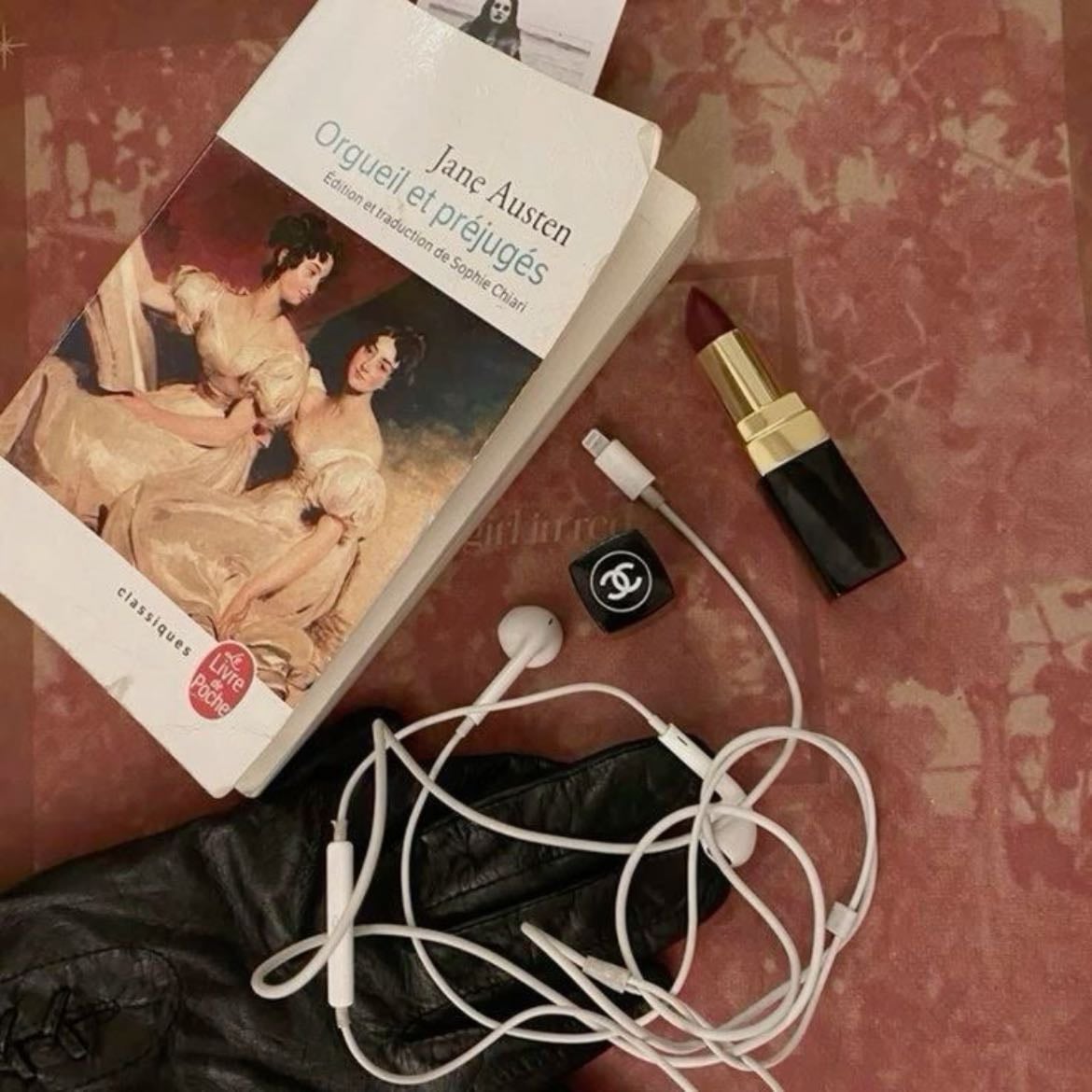 Headphones on, book on