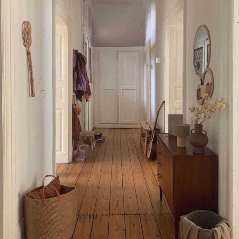well-worn, messy entryway - a place where shoes are tossed, coats are hung, and there’s always a welcoming clutter of everyday life—keychains, letters, and a spare umbrella or two.