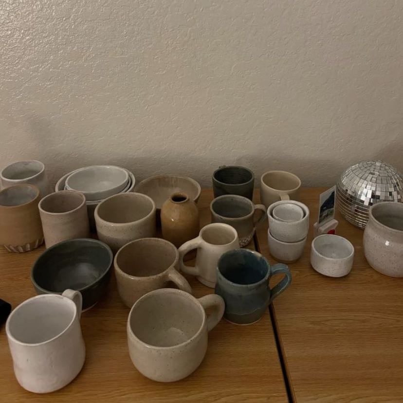 an eclectic collection of mismatched mugs - no two are the same, but they all have a story—whether it’s from a memorable trip or just a great find at the flea market.