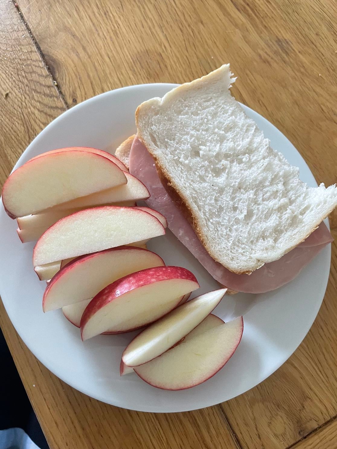 Sandwich + Apple ~ 167 - Bread ~ 98kcal
Ham slice ~ 19kcal
Pink lady apple ~ 50kcal