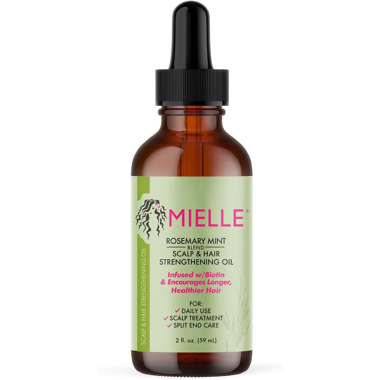 2. Aplicación de hair oil - Dividir en secciones el cabello y aplicar el rosemary oil por toda la raíz. Yo uso el Mielle rosemary oil.