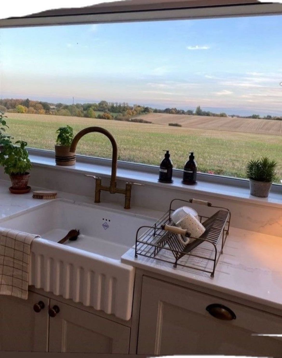 big window in front of kitchen sink - with a good view