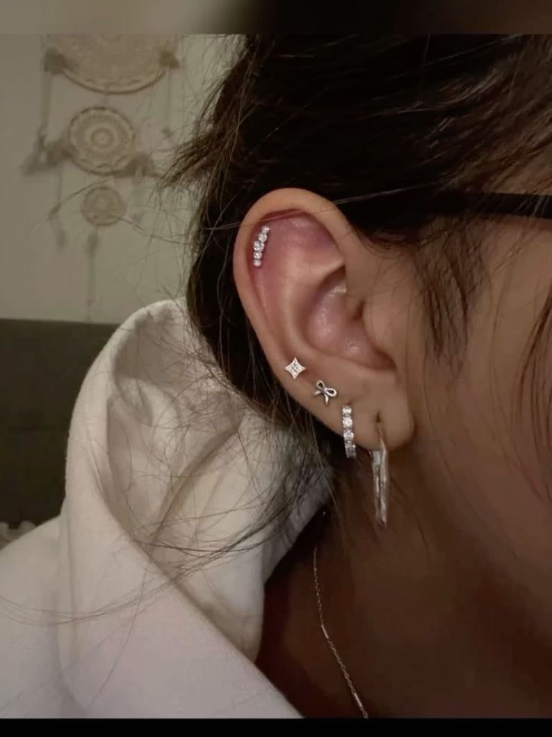 12. have a load of ear piercings - currently I have up to my thirds and a conch, I’m meant to be getting a rook soon but I love them so much. I just want loadssss