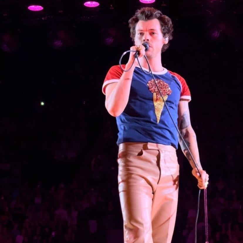 la 10/24/2022 - blue tee with red sleeves and icecream cone on front, tan pants, red converse