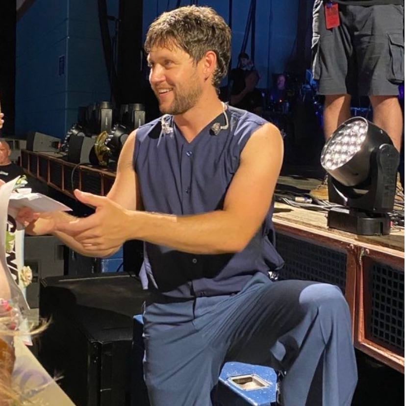 #36 — cincinnati - dark blue button up tank top, mid-blue pants (also maybe black??), white dress shoes