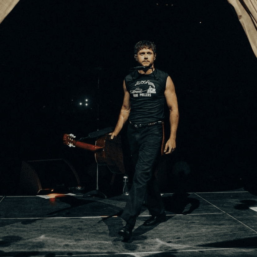#20 — bristow - black “mini pullers” tank, black pants, dress shoes, maroon handkerchief,