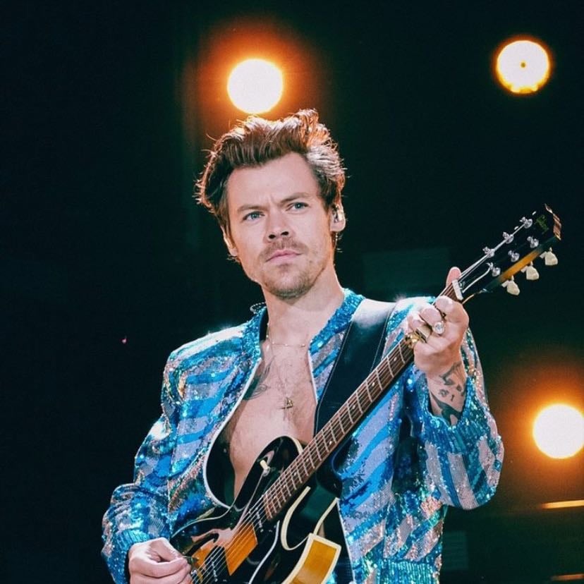 munich 05/18/2023 - no shirt, black and silver sparkly striped jacket, blue and silver sparkled pants, green satellite stompers