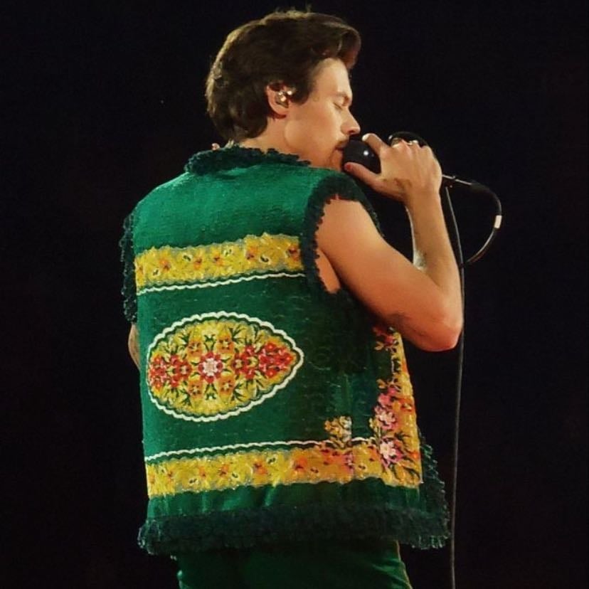 la 11/17/2021 - green pants, no shirt, ..green carpet vest?, white boots