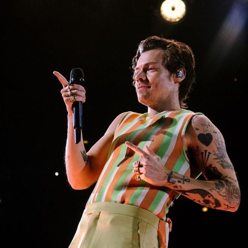 chicago 10/09/2022 - white, orange, & green tank top, yellow-ish green pants, black satellite stompers