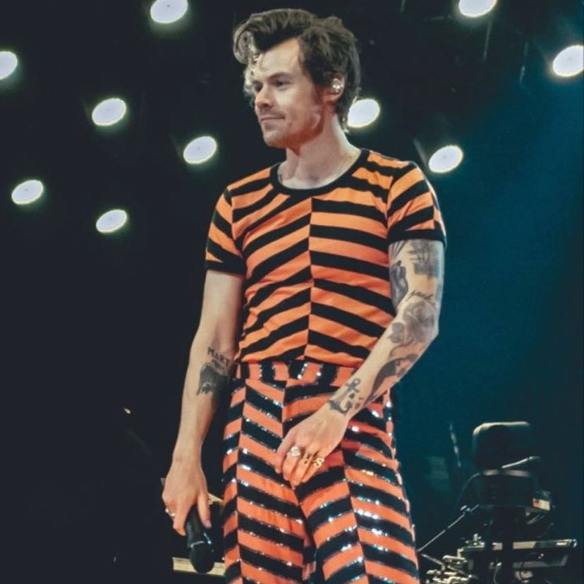 austin 09/28/2022 - orange and black striped bodysuit