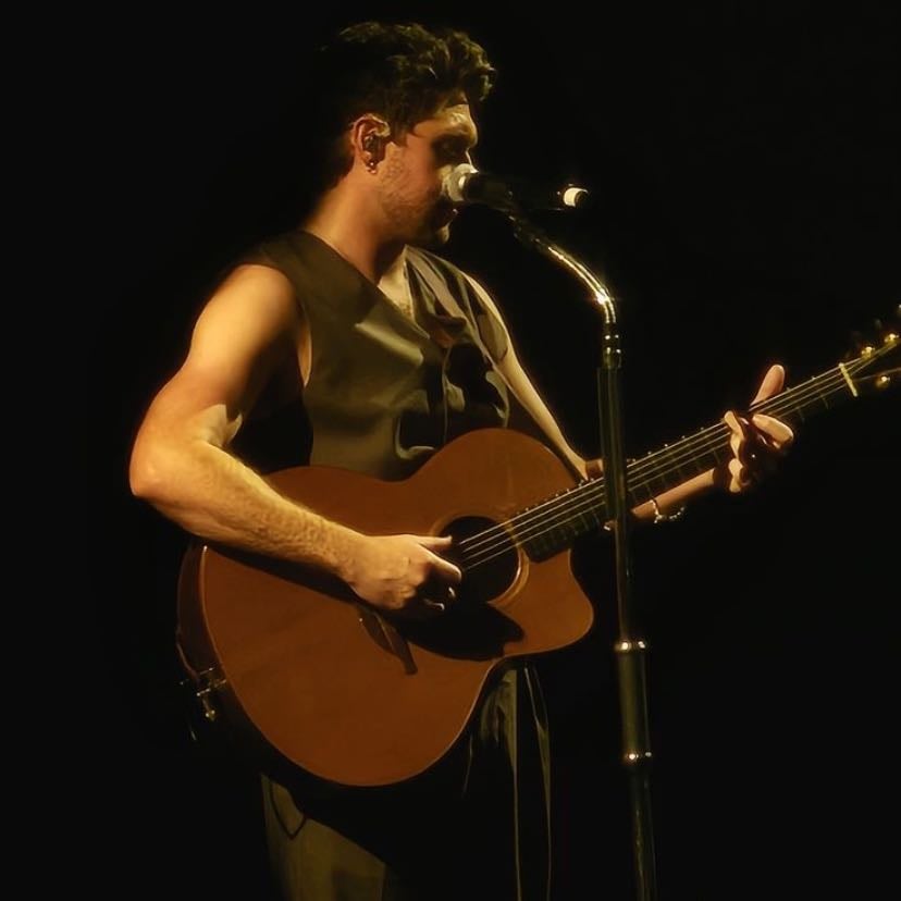 #70 — auckland - black under-tank, black buttoned vest, black pants, dress shoes