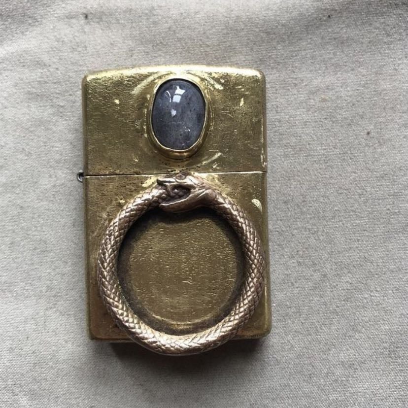 ouroboros lighter - honestly just anything with this fk symbol