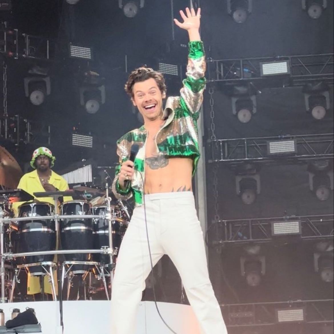slane 06/10/2023 - White leather pants, no shirt, green and silver sparkly vest, dark green satellite stompers