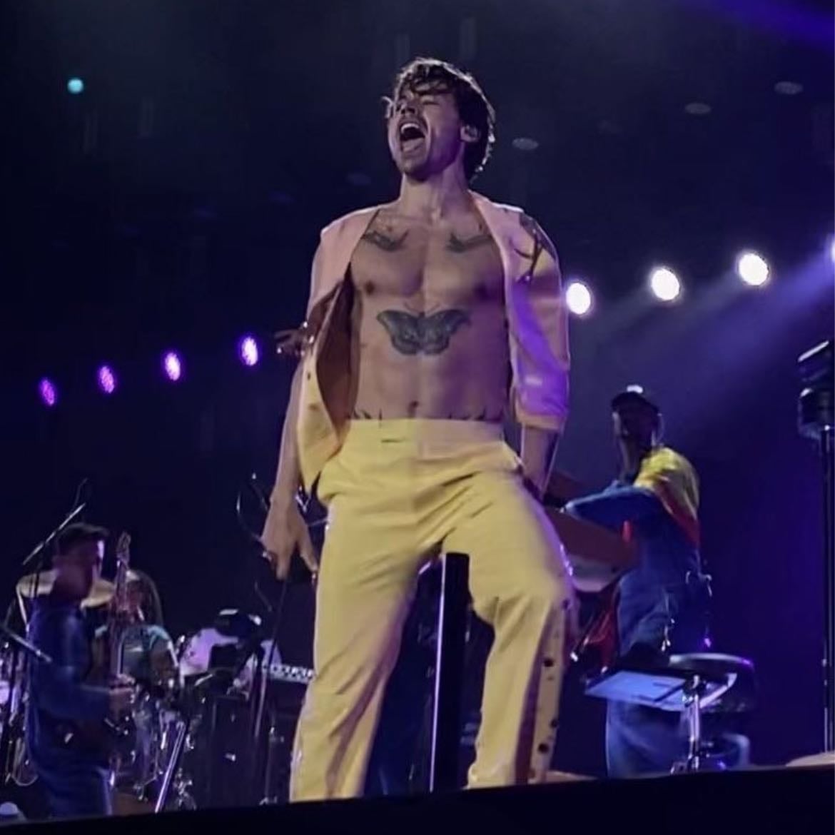 sydney 03/04/2023 - Light yellow loose pants, no shirt, light pink and light yellow tank top vest with pink tinsel and rhinestones