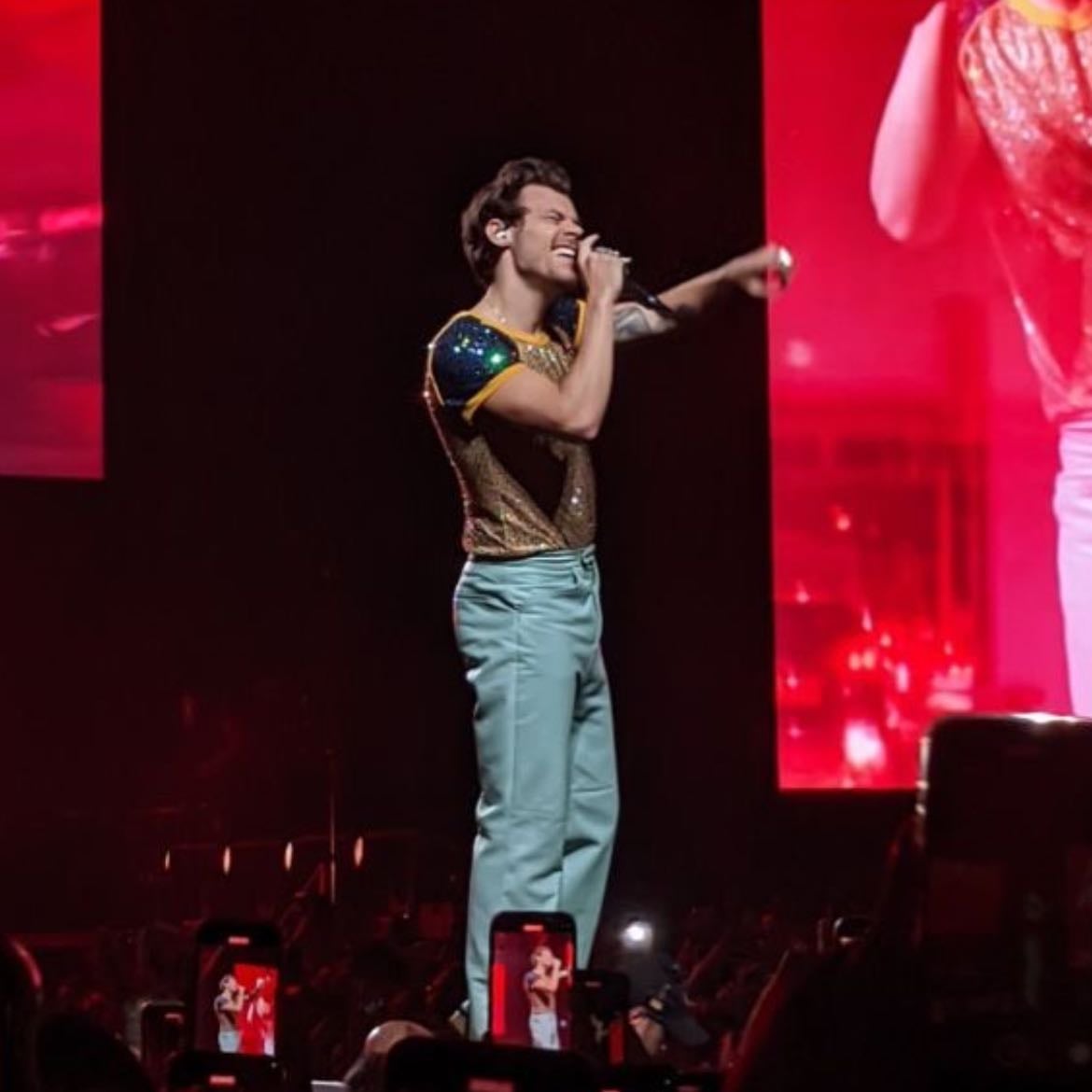 manila 03/14/2023 - Light blue leather pants, gold sparkly T-shirt with blue sparkly sleeves, dark green satellite stompers