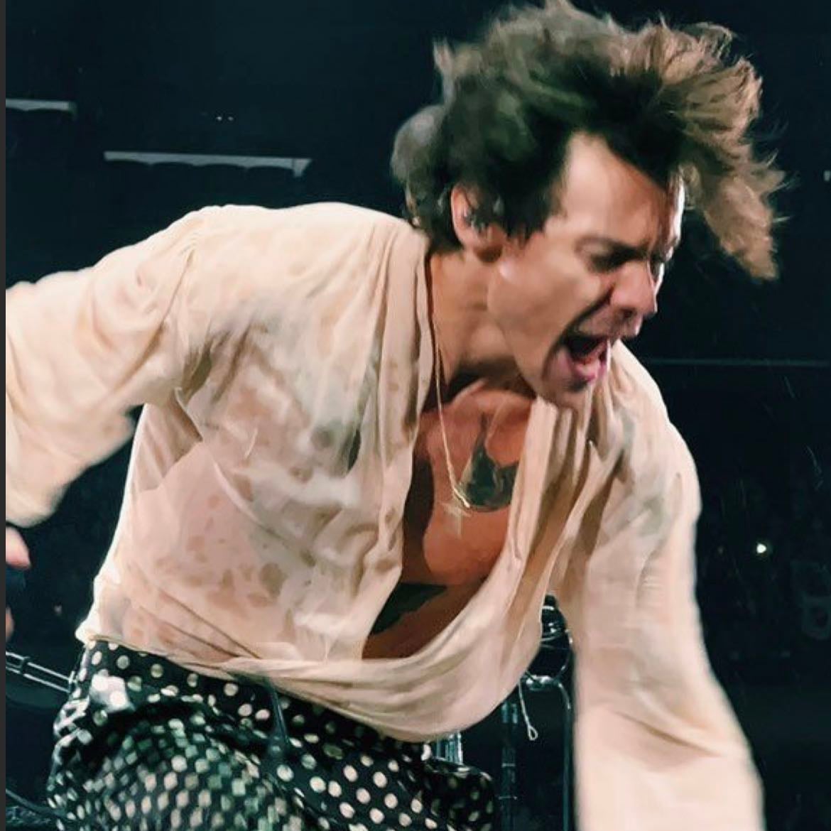 nyc 10/04/2021 - Black loose pants with white polkadot, white see threw long-sleeve shirt, black boots
