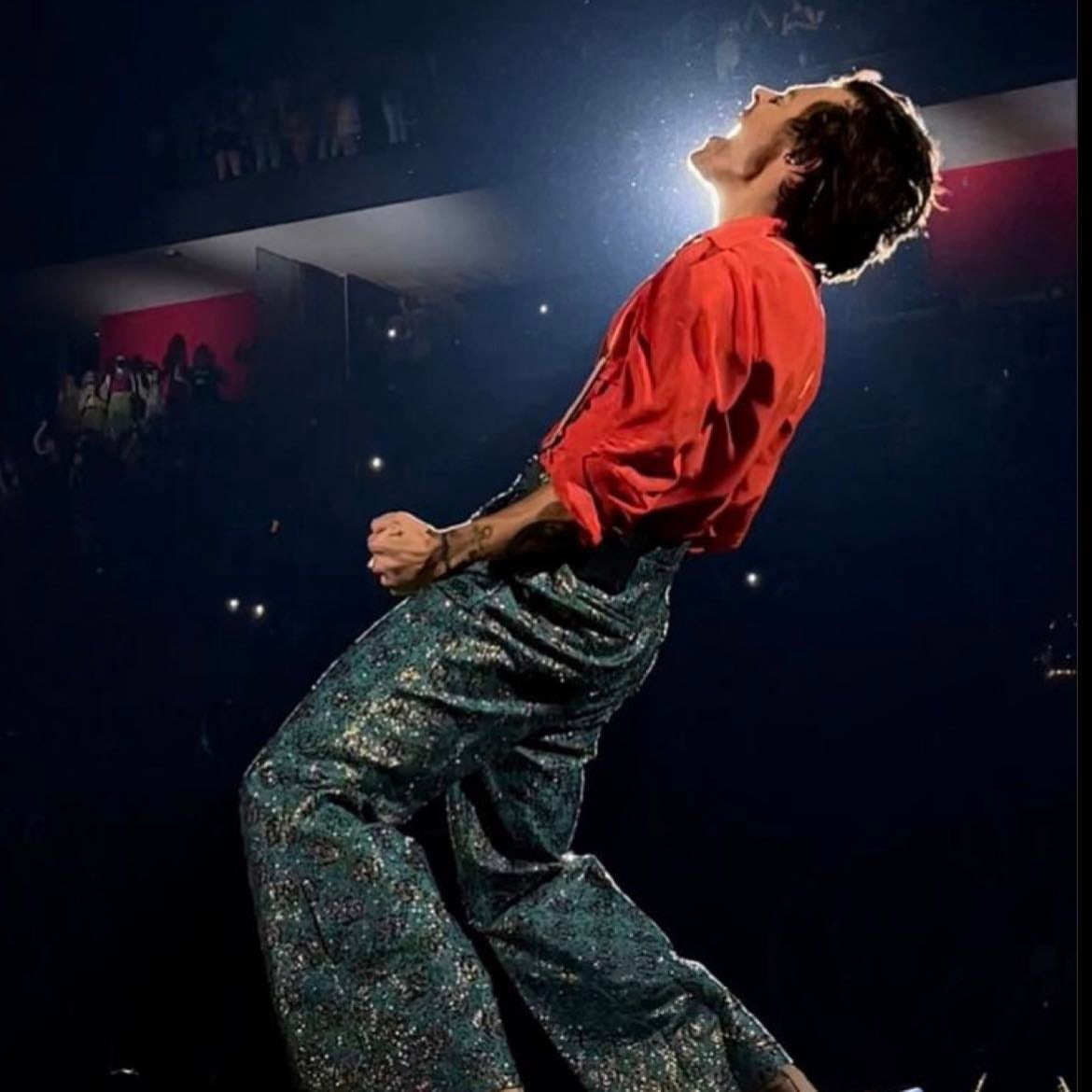 detroit 09/20/2021 - Greenish blue and gold glittery checkered pants, light pink suspenders, orange long-sleeve button up