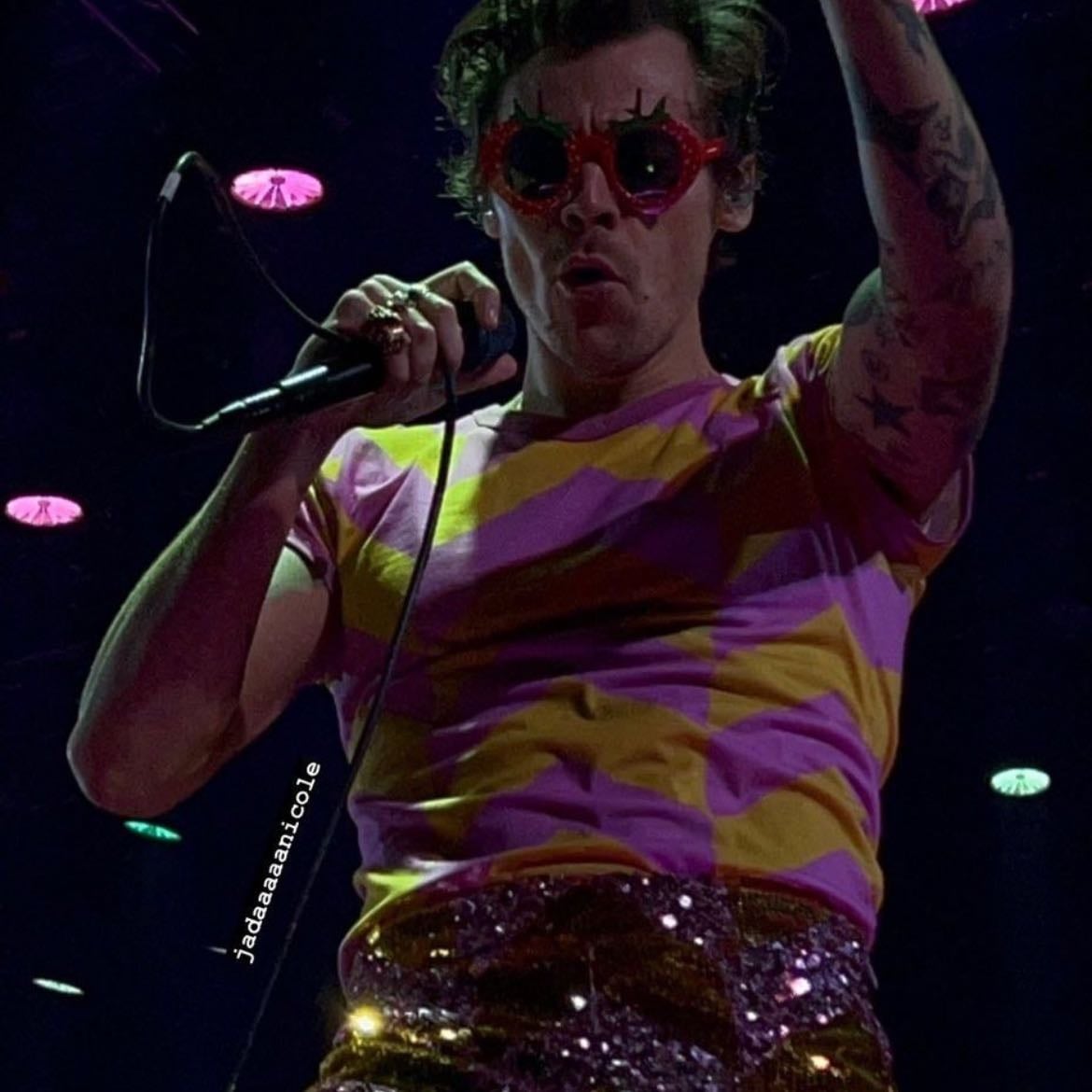 nyc 09/07/2022 - Pink and yellow sparkly leather pants with an arrow pattern, pink and yellow T-shirt with an arrow pattern, pink satellite stompers
