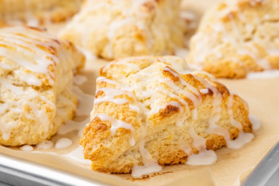 lemon scones - ( w/ raspberry/blueberry jam + clotted cream)