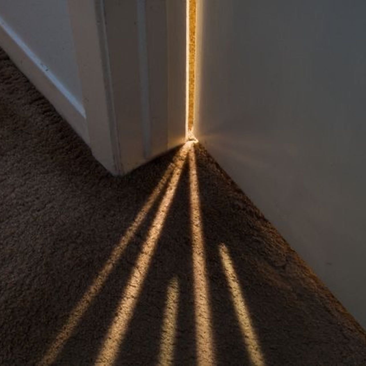 Concept of ray of sunshine in a dark room