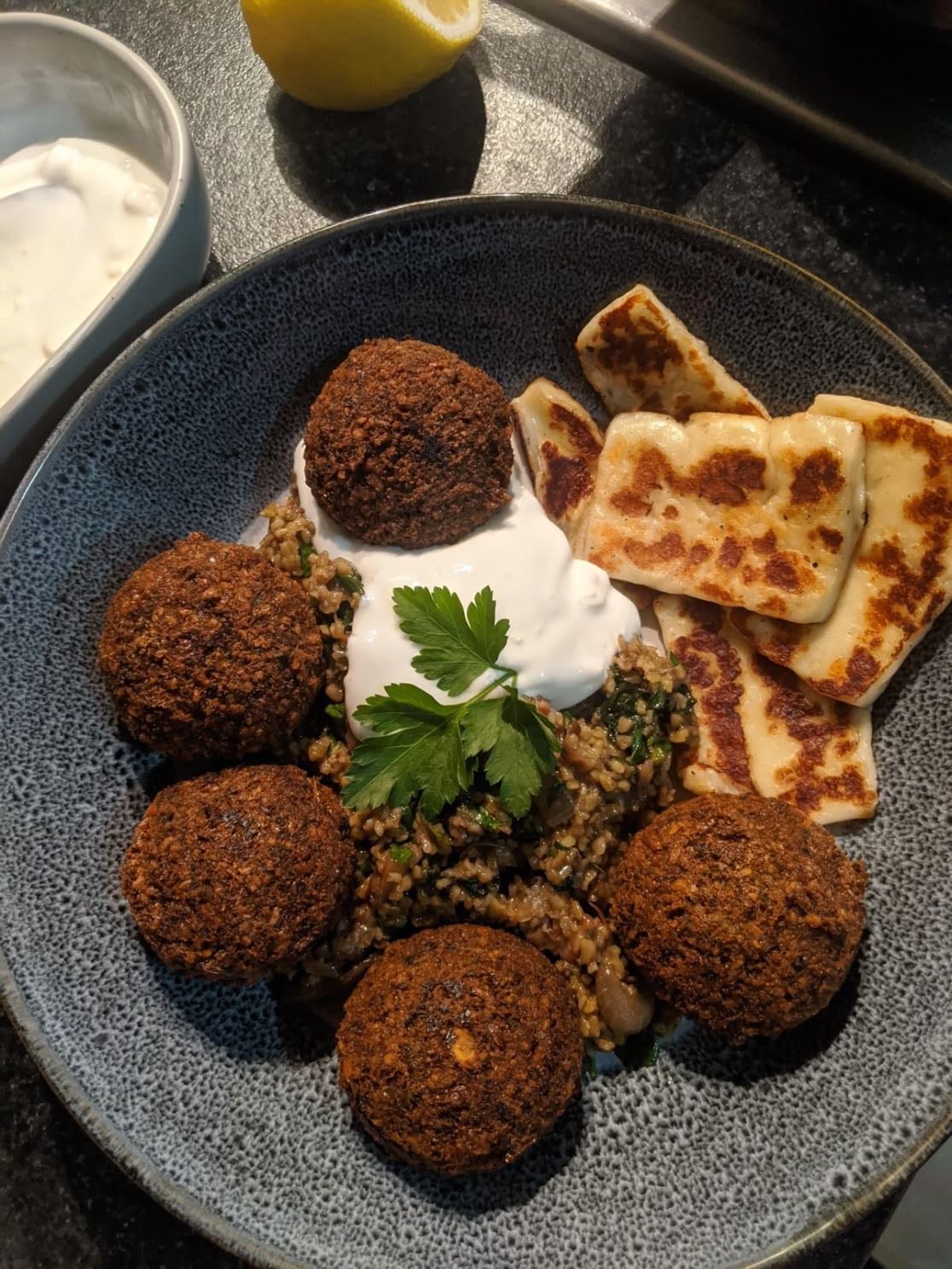 falafel with tahini sauce - 1 cup chickpea
2 cloves of garlic
1 small onion
half a bunch of parsley
fresh mint
cumin
black pepper
chili flakes
salt
1.5 tablespoons of corn flour
mix in a blender
for the tahini sauce
2 tablespoons of yogurt
1 tablespoon tahini
half lemon juice
salt