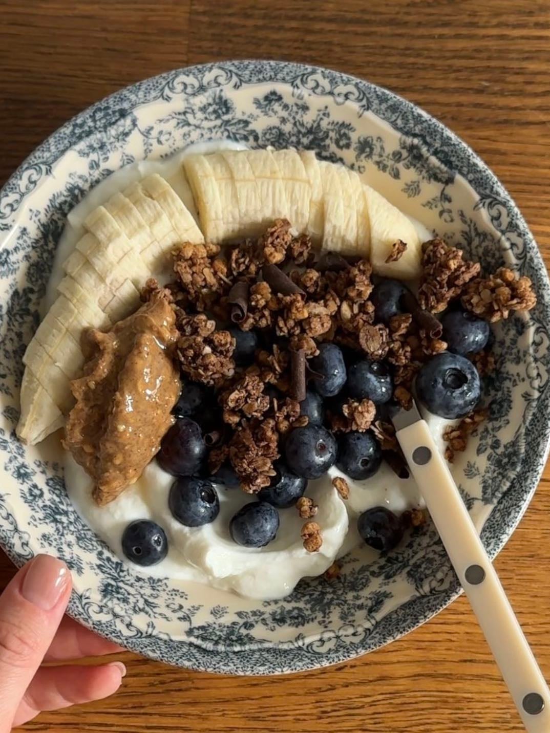 Breakfast yoghurt bowl - with blueberries, banana and high protein chocolate granola