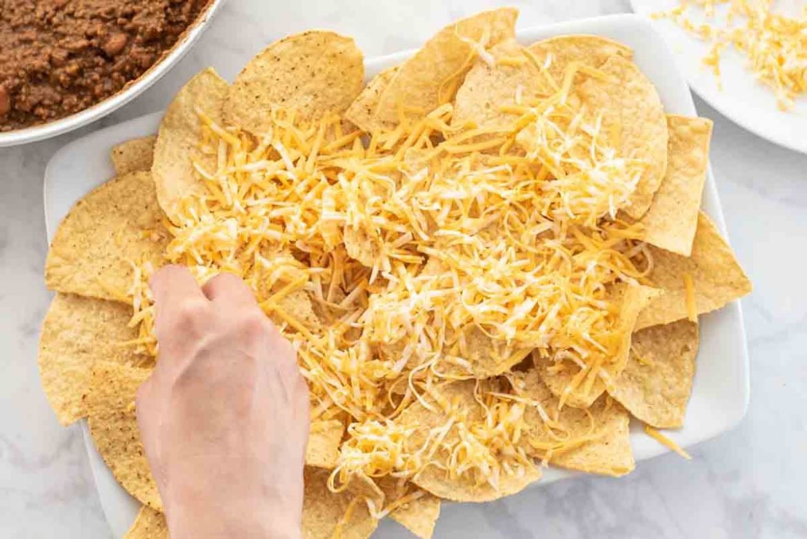 White People Nachos - Corn chips. Cheese. Microwave. 30 seconds