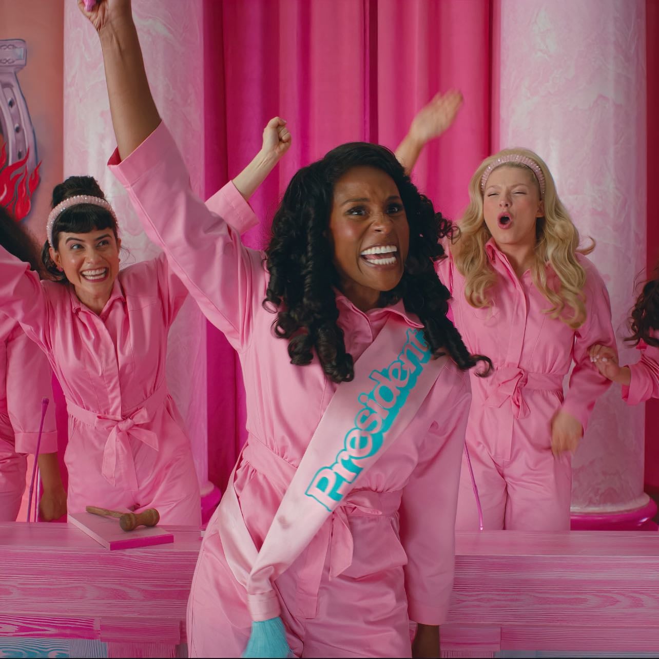 when the barbie’s celebrate getting their home back. - barbie (2023)