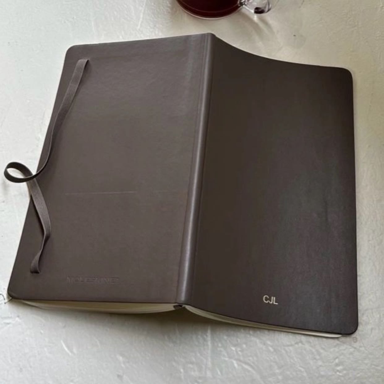 A note book with initial or name