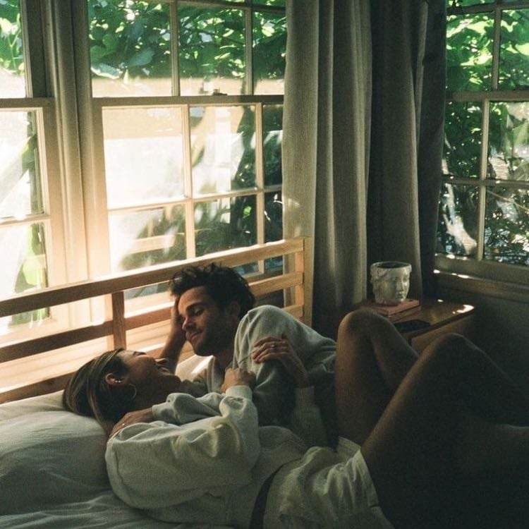 Laying in bed with someone