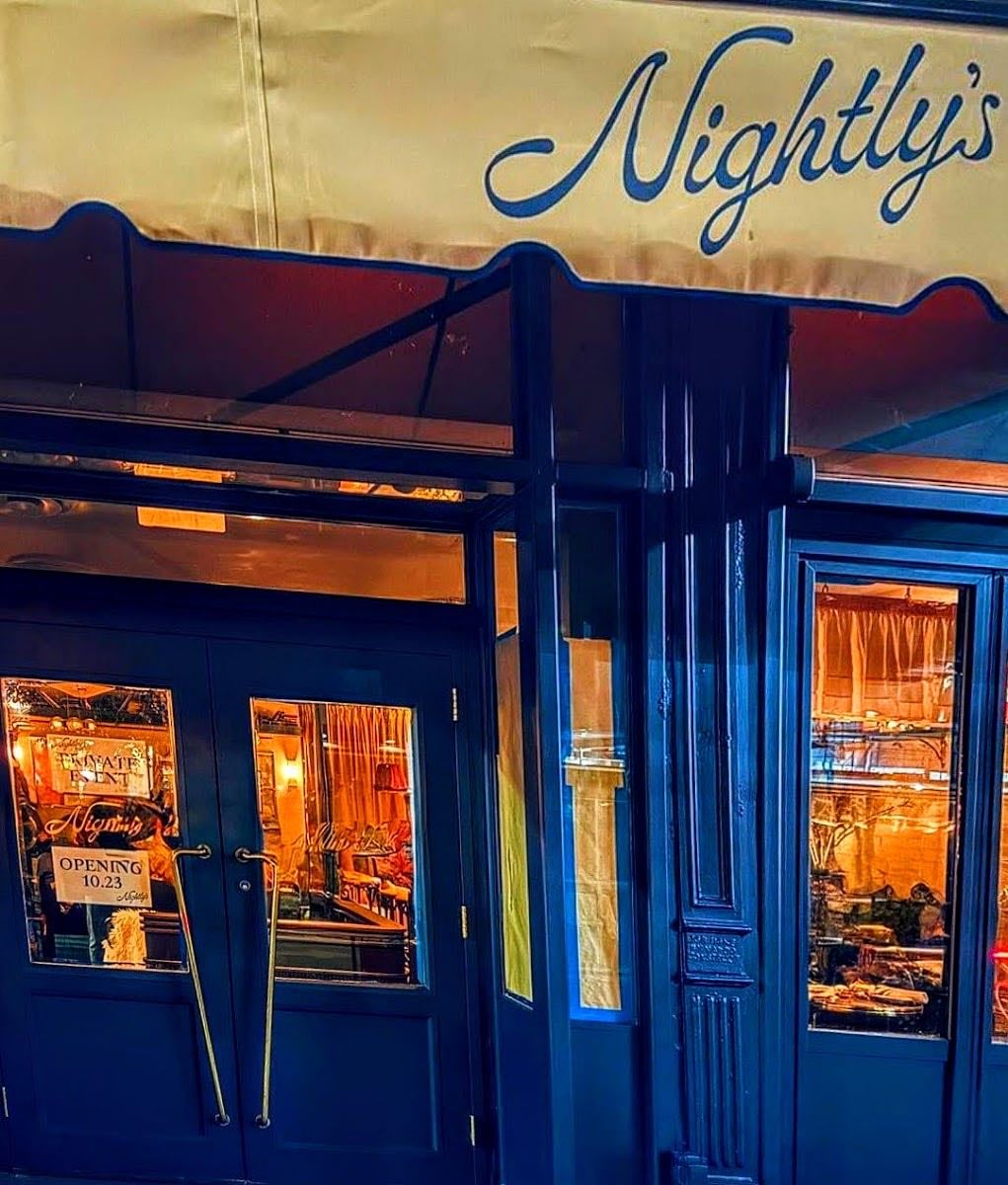Nightly's - Chic bar and bistro with low lights.