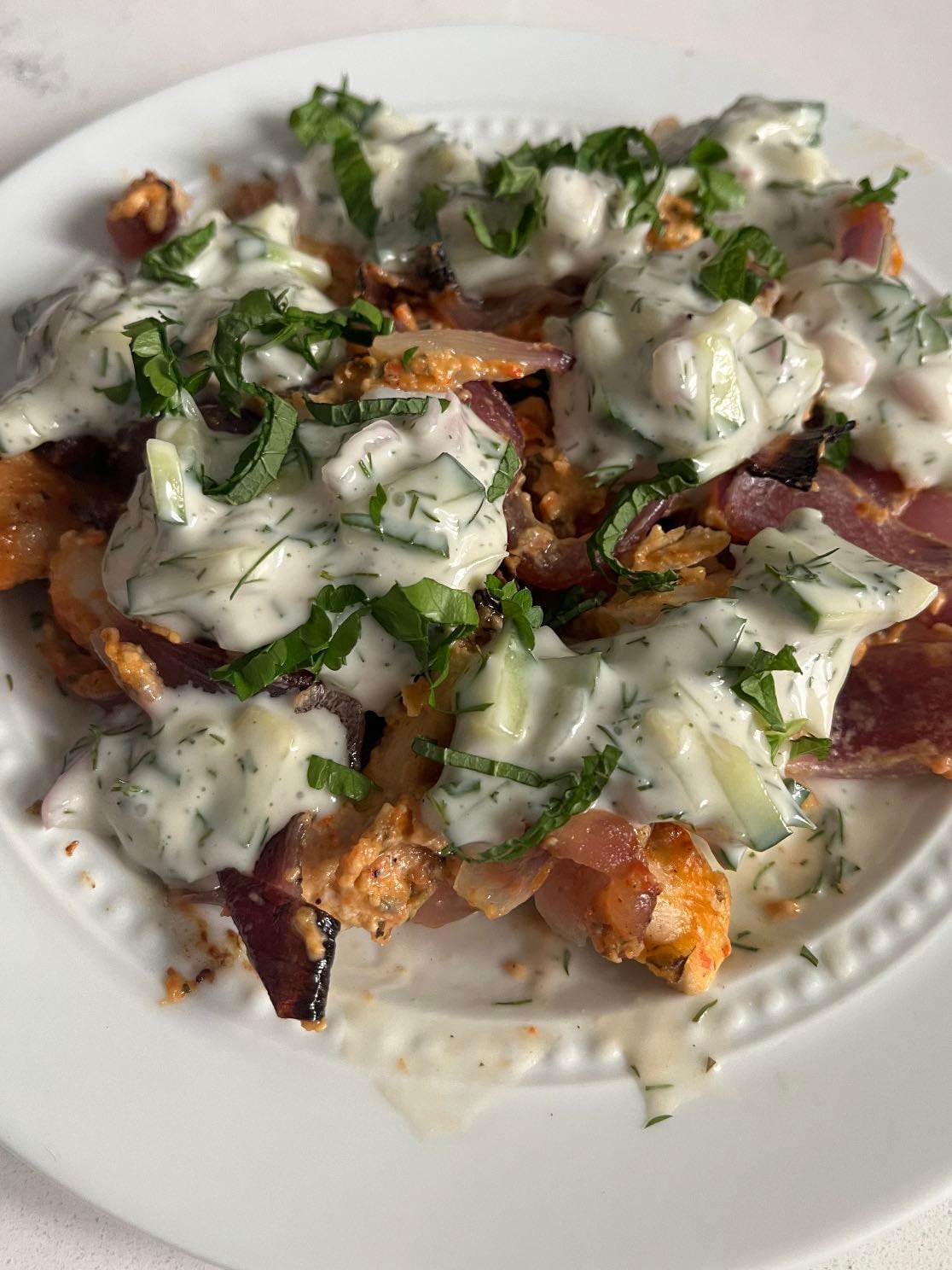 Chicken shawarma pan - Chicken marinated for two days. Cooked in the oven with red onion (400 degrees, 40 mins). Topped with df tzatziki, mint, and parsley.